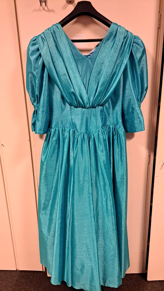 Feestjurk turquoise , foto 1 van 2